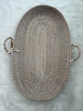 Boho-style wide baby changing basket handcrafted from seagrass